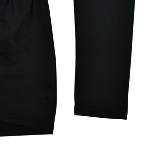 Close-up of black fabric texture and sleeve stitching on a casual zip-up romper