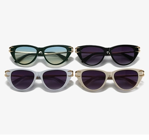 Detailed view of four cateye sunglasses with gradient lenses and metal hollow hinge design