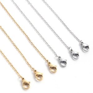 Polished stainless steel cross chains in gold and silver with secure lobster clasps