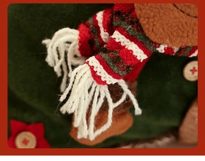 Close-up of knit striped scarf and felt texture on Christmas pillow cover decoration