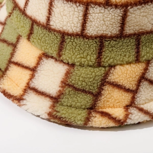 Thick checkered faux lamb wool bucket hat with soft plush texture in olive and cream