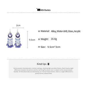 Detailed view of bohemian teardrop tassel earrings with size measurements and materials