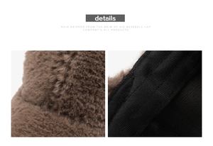 Close-up of the plush brown faux fur texture and the black fabric lining of the baseball cap