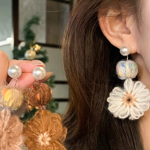 Elegant pearl and handcrafted crochet flower drop earrings for a warm winter aesthetic