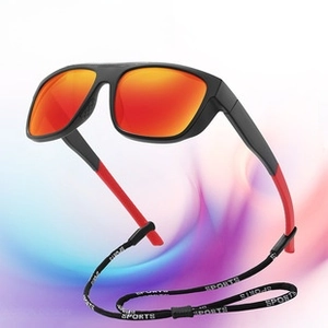 Detail of polarized sports sunglasses with orange gradient lens and adjustable neck strap