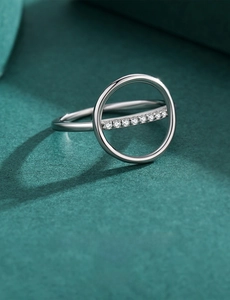 Macro detail of minimalist 925 silver ring featuring a geometric band set with sparkling pavé stones