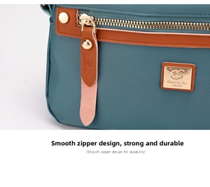 Detail of smooth metal zipper and logo plaque on water-resistant nylon crossbody bag