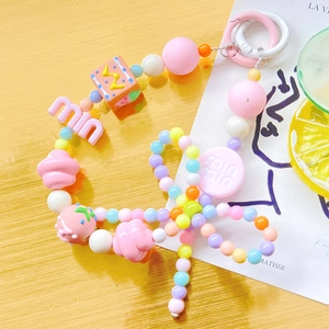 Close-up of candy-colored beaded phone strap with floral and letter acrylic beads