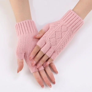Detail of pink knitted arm warmers with a diamond cutout pattern and fingerless design