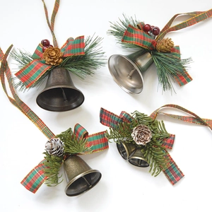 Christmas bell ornaments with pine needles, cones and velvet bows for holiday decor