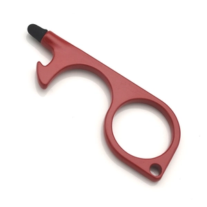 Macro detail of red zinc alloy no-touch door opener tool with black silicone stylus tip