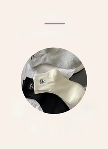 Detail of high-quality knit cotton socks with cute embroidery and elastic ribbed cuffs