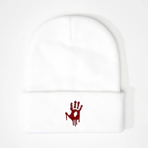 White knit beanie with red bloody handprint embroidery in streetwear style