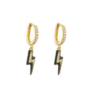 Detailed view of gold lightning bolt earrings with black enamel and micro-pave zircons