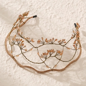 Detailed view of handmade bridal headband with pink beads and sparkling rhinestones