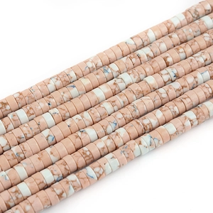 Detailed macro view of pink and white flat disc natural stone beads for DIY jewelry
