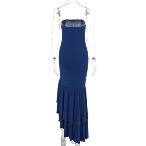 Detail of navy strapless dress featuring asymmetric ruffled fishtail hemline layer