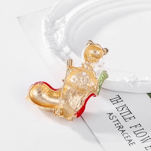 Christmas cat in stocking brooch pin with red enamel and gold metallic textures