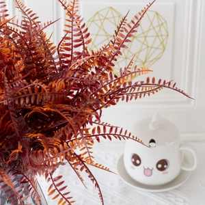 Artificial reddish-brown Boston fern plant with detailed foliage for indoor and outdoor decor