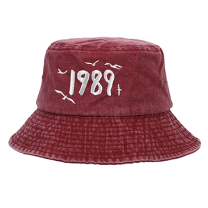 Close-up of seagull embroidery and 1989 text on a burgundy cotton baseball cap
