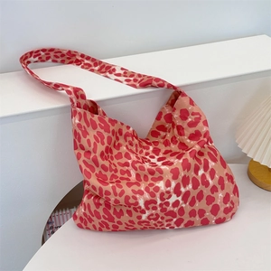 Detail of pink leopard print hobo bag showing large capacity and soft canvas material