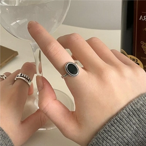 925 silver vintage adjustable ring with black onyx stone in a minimalist lifestyle setting