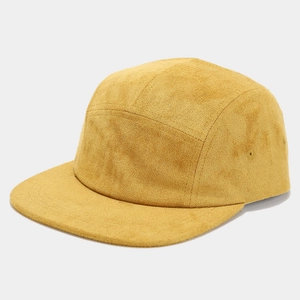 Detailed texture of mustard yellow suede 5-panel flat brim baseball cap with vintage finish