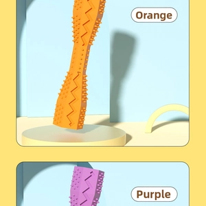 Close-up of durable rubber pet chew toys with cleaning texture in orange and purple