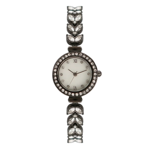 Detailed close-up of a luxury mermaid style watch with crystal metal strap and stone bezel