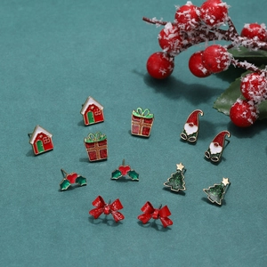 Festive Christmas stud earrings set featuring Santa, tree, and gift box designs