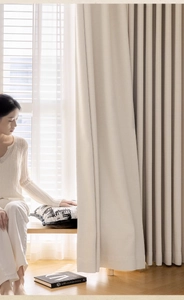 Detailed texture of thick beige linen blackout curtain showing modern minimalist fabric