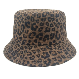Detailed close-up of leopard print corduroy bucket hat texture and reinforced stitching