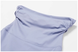 Macro detail of lavender high waist yoga pants showing ruched texture and fine stitching