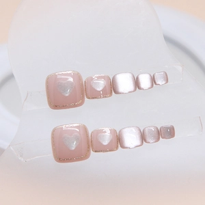 Pink cat eye press-on toenails with heart patterns and glitter finish for women
