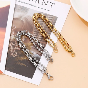 Detail of gold and silver double-layered stainless steel bead and link chain bracelets