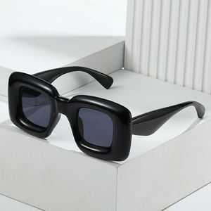 Y2K fashion square chunky black sunglasses with smokey lenses on a geometric base