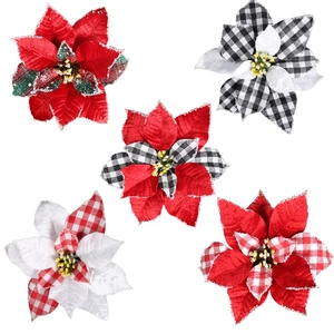Detail showing five artificial Christmas poinsettia flowers with glitter edges for decor