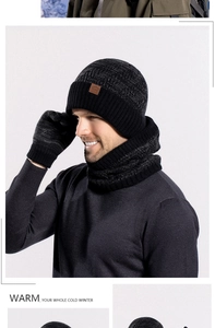 Close-up of winter knit set with beanie hat, scarf, and gloves in marled grey texture