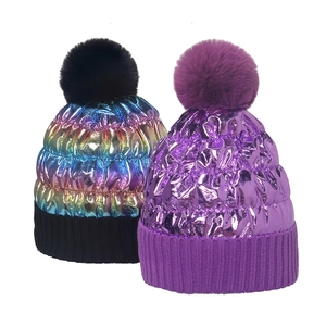 Winter metallic knit beanie with large fluffy faux fur pompom and ribbed cuff