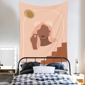 Abstract bohemian wall tapestry with female silhouette above a bedroom bed frame