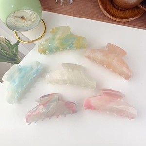 Detailed set of large acetate hair claws with marble textures in various colors