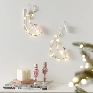 Two lighted moon wall decorations with pink fairy doll and silver star for Christmas home decor