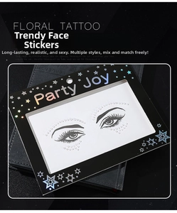 Detail of self-adhesive white pearl face gems on a black card for artistic makeup