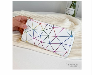 Detail of white geometric grid long wallet featuring a colorful holographic laser finish