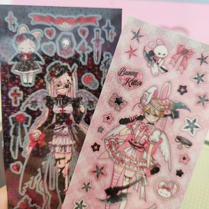 Close-up of holographic goth and pink anime girl stickers with heart and star patterns