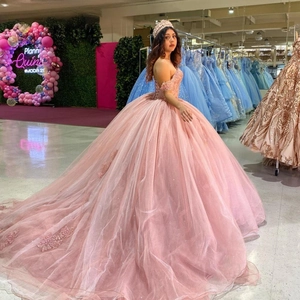 Pink puffy glitter tulle ball gown with lace appliques and off-shoulder design