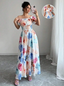 Gros plan du décolleté floral et des manches bouffantes sur une robe d'été à taille haute