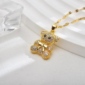Golden bear pendant necklace with sparkling zircons and a matching chain for women