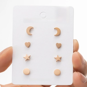 Rose gold stainless steel stud earrings set with moon heart star and round shapes