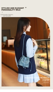 Fashionable light blue bucket bag with drawstring closure and slim shoulder strap on model
